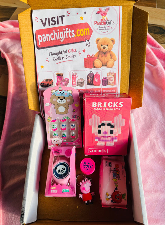 Pink return gift box open showing bricks, wristband and accessories inside