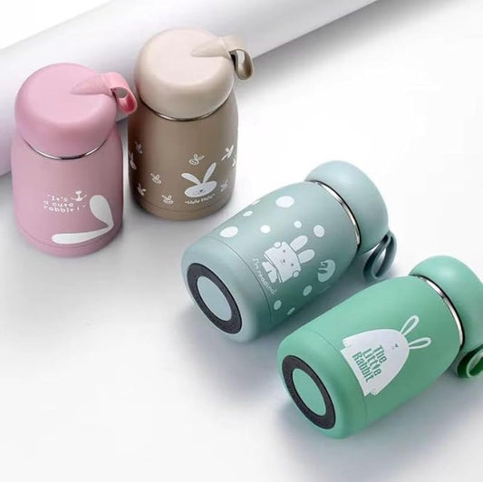 Rabbit print 330ml bottles in pink, beige and green with carry loops