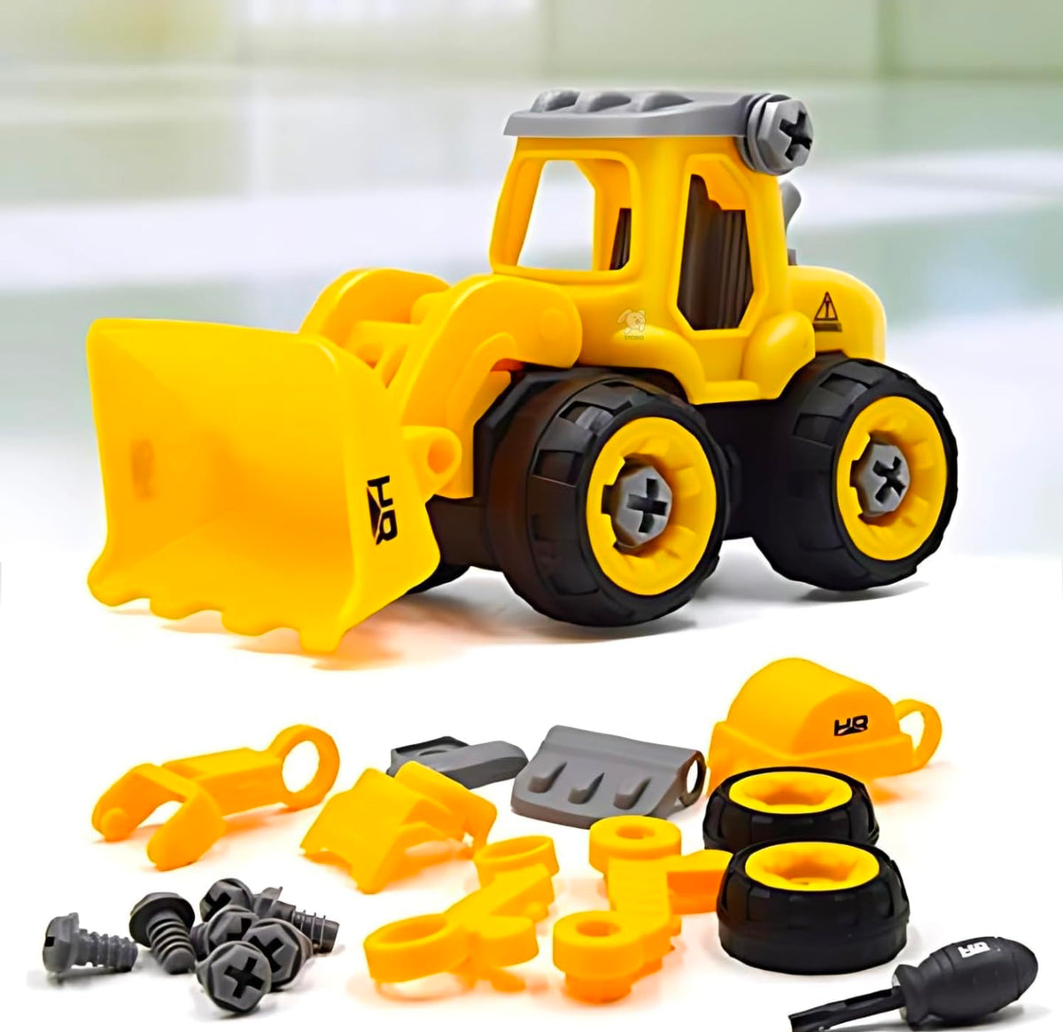 Yellow bulldozer toy above its loose parts, tyres and screwdriver