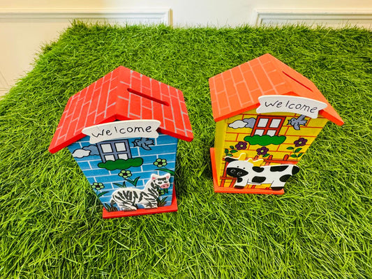 Blue and yellow wooden house piggy banks with zebra and cow designs