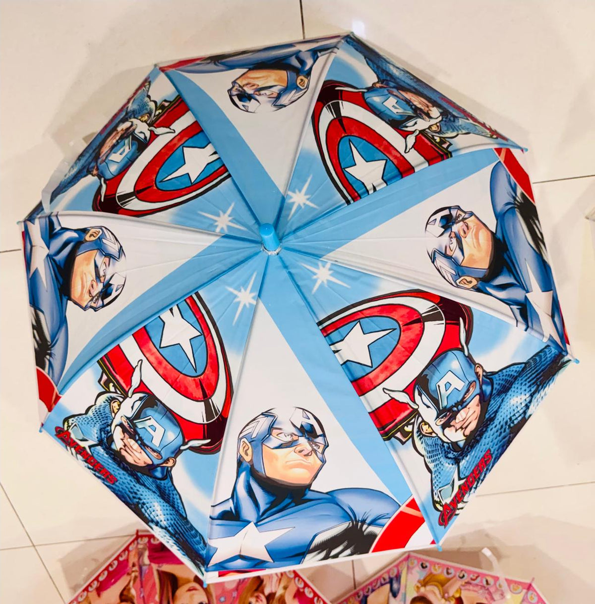 Blue and white kids umbrella with superhero shield print