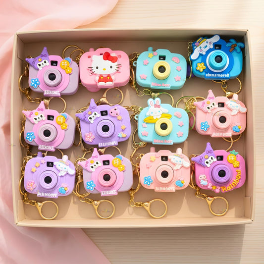 Boxed set of cartoon camera keychains with animal characters and bell charms