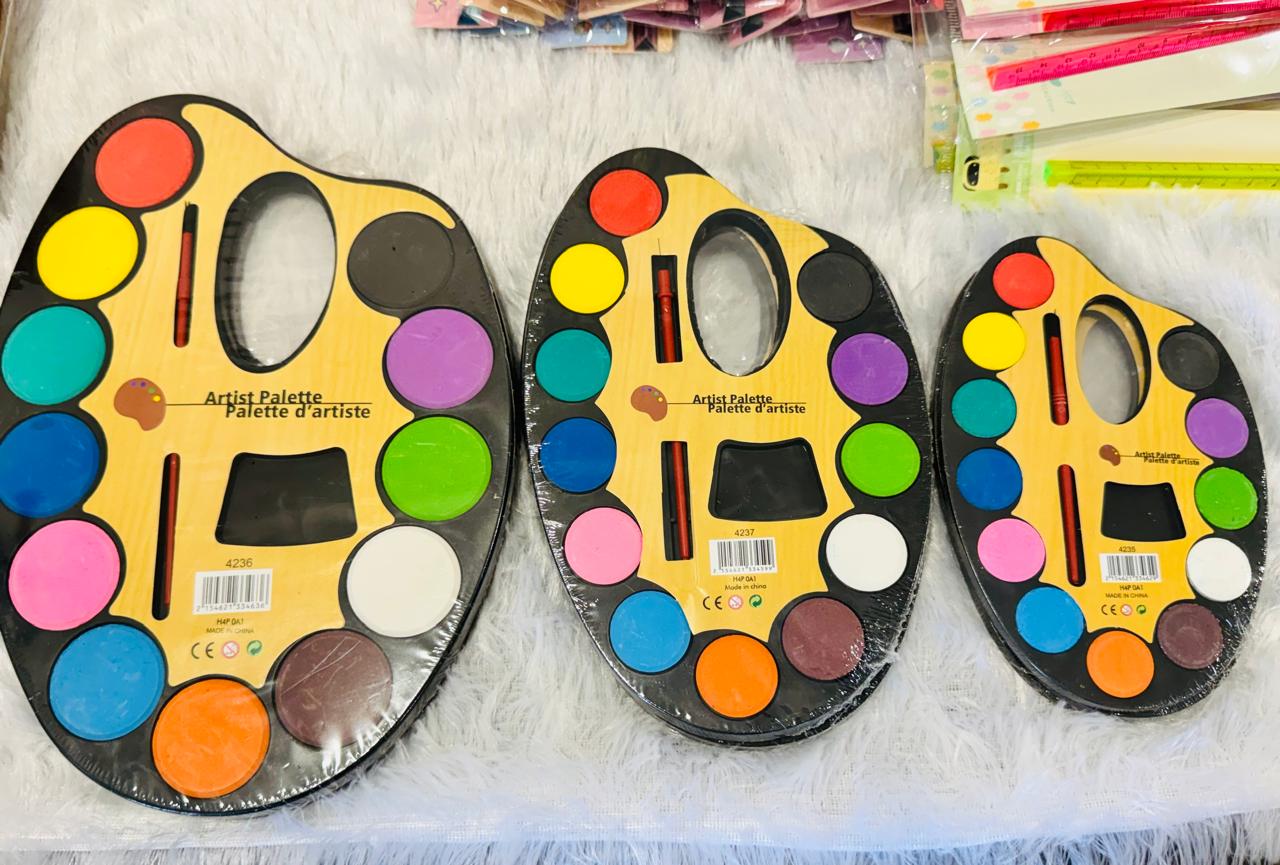 Three large oval watercolour artist palettes with twelve pans and brushes