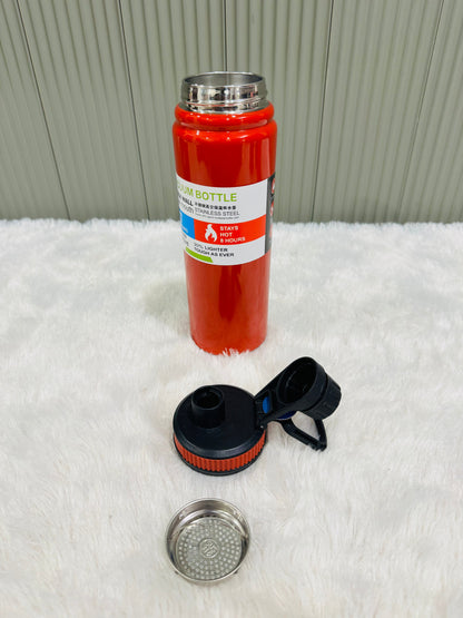 Red 800ml bottle with black lid and steel strainer placed alongside