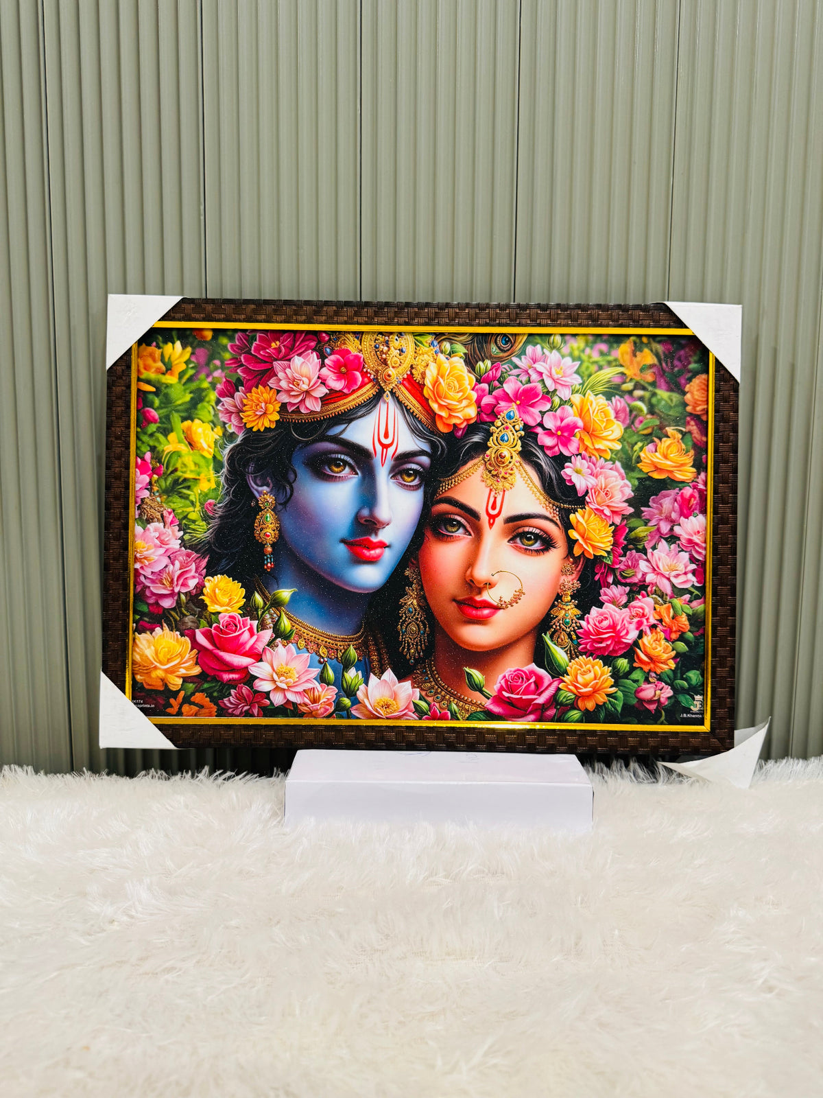 Golden framed Radha Krishna floral portrait wall painting on a stand