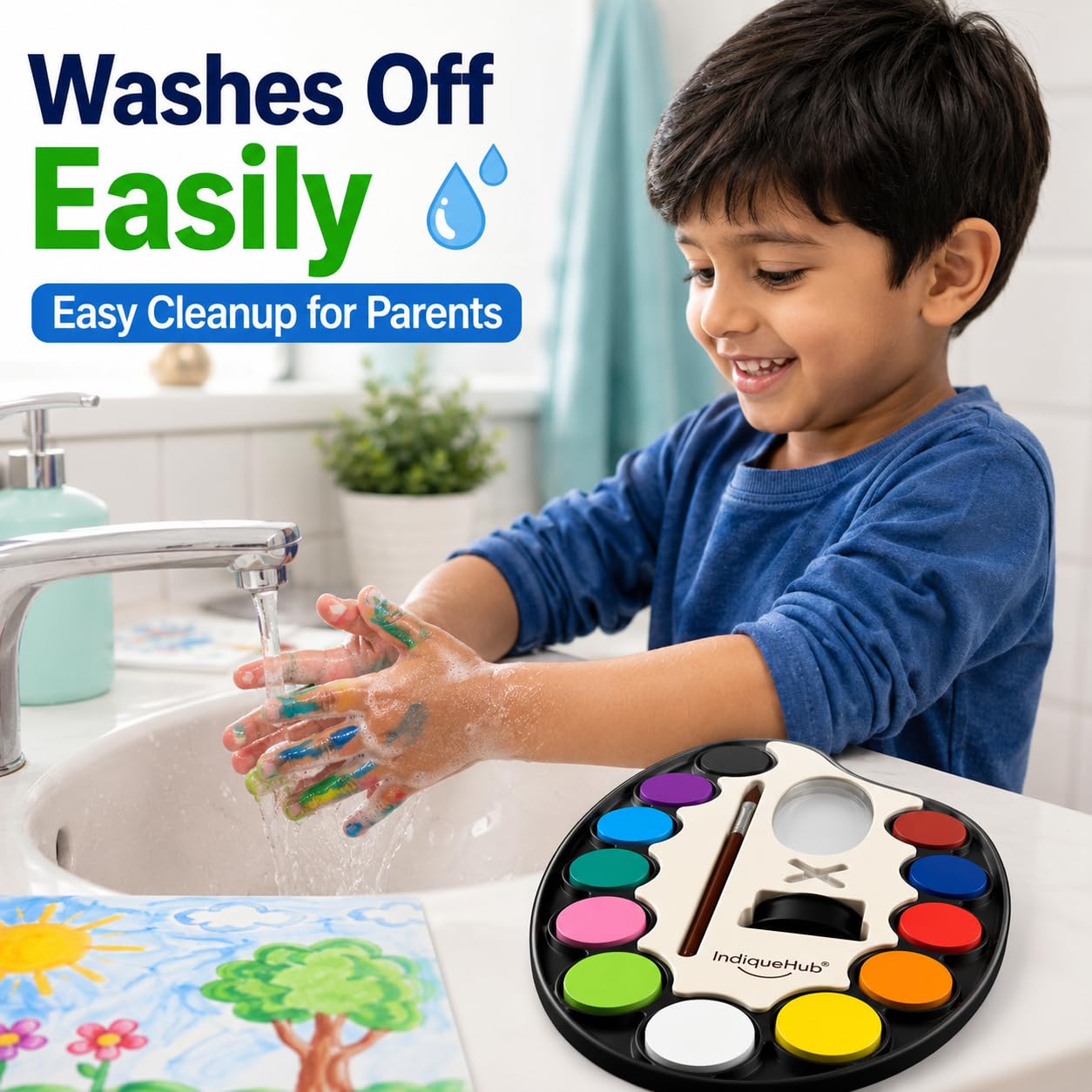 Boy washing paint off his hands at a sink beside a watercolour palette