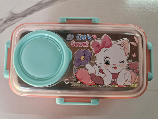 Pink lunch box with cartoon kitten print and green round sauce bowl