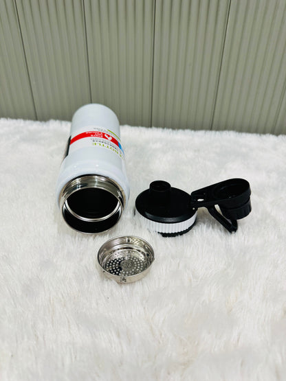 White 800ml bottle lying down with lid and steel strainer alongside