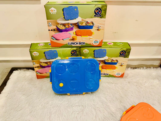 Blue explorer lunch box in front of stacked printed packaging boxes