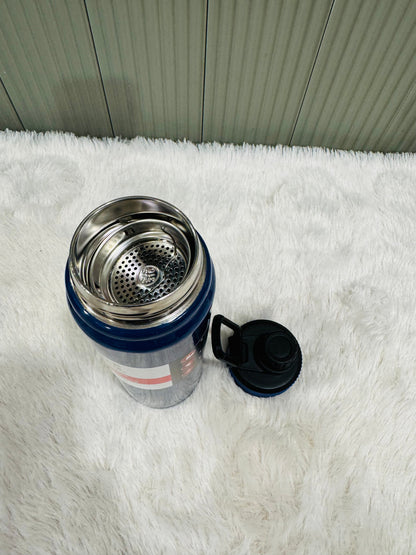 Navy 800ml bottle lying down showing steel strainer insert and lid
