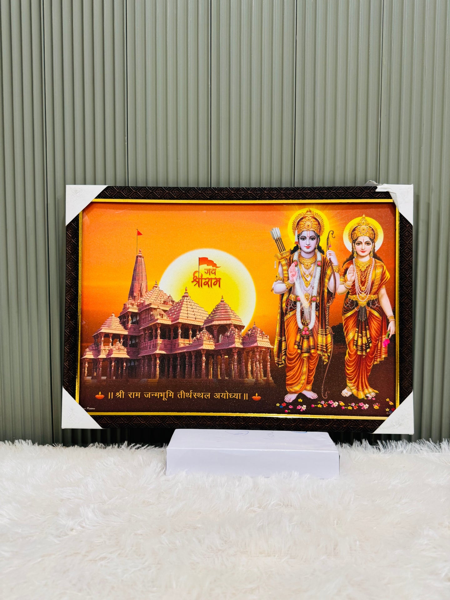 Golden framed Ram Ayodhya temple wall painting on a display stand