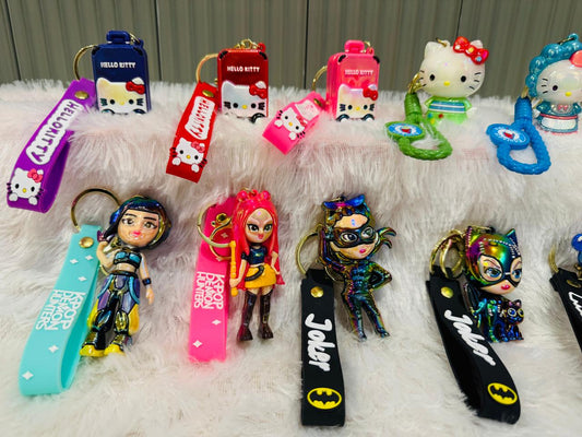 Cartoon cat and doll figure keychains with coloured silicone straps