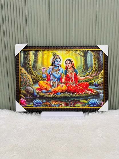 Golden framed Radha Krishna forest scene wall painting on a stand