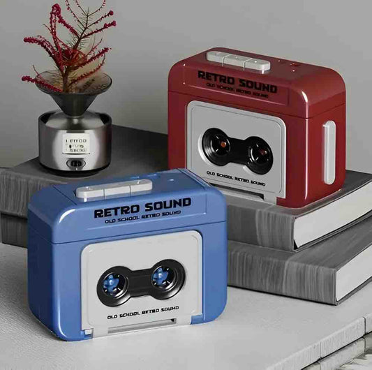 Retro cassette style mini recorder keychains in blue and dark red on books