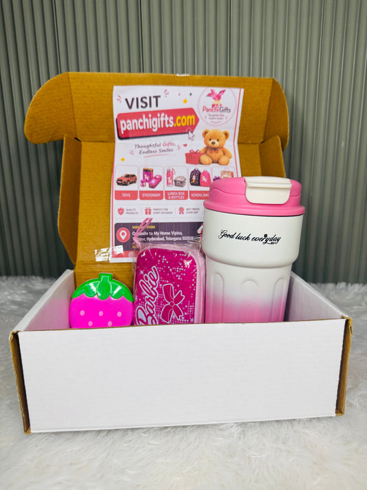 Open mailer box with pink ombre travel mug, coin pouch and strawberry pouch