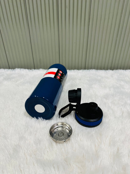 Navy 800ml bottle on its side with lid and strainer laid out