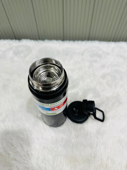 Open black 800ml bottle showing steel strainer insert inside neck