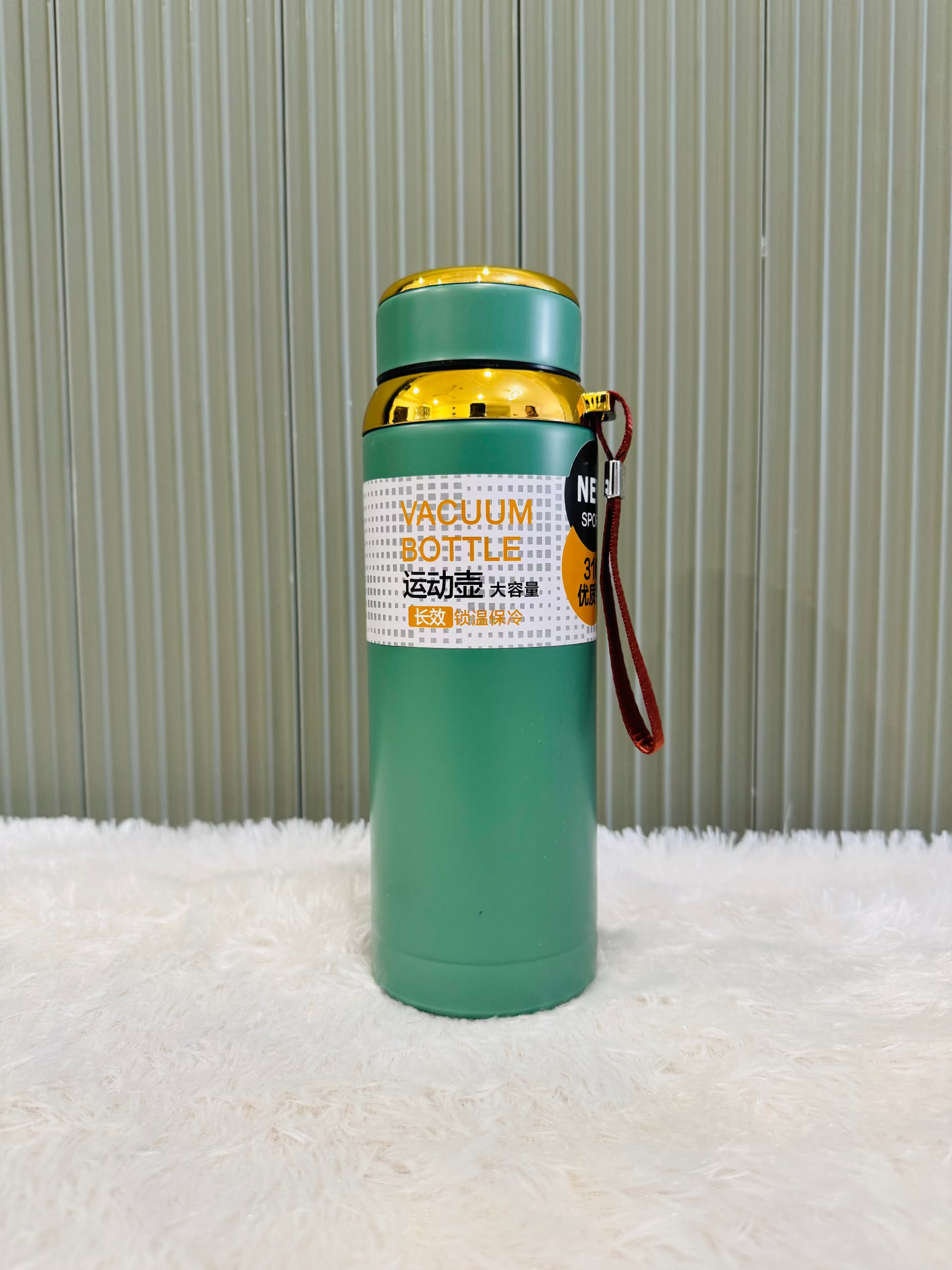 Green 800ml vacuum flask with gold trim and cup lid fitted