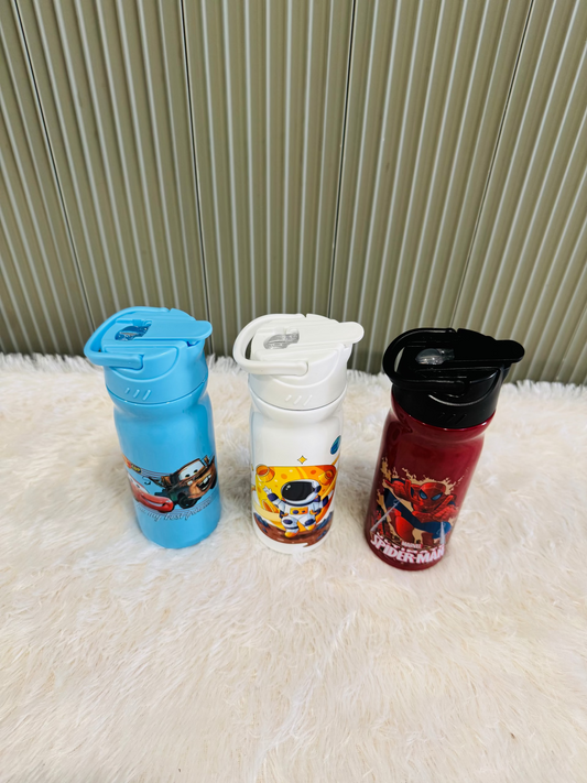 Three 400ml cartoon print kids bottles with flip lids on a rug