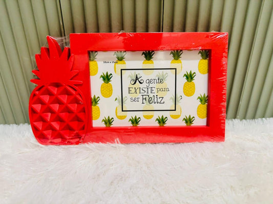 Red pineapple photo frame with a matching pineapple ornament beside it