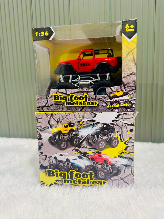 Red boxed off road toy car above a display carton of more cars