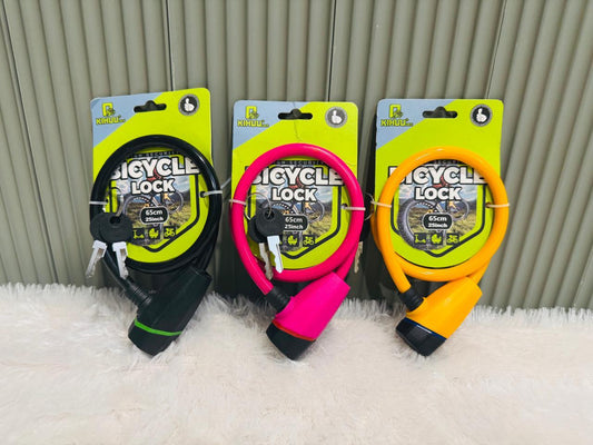Black, pink and orange bicycle cable locks on printed backing cards