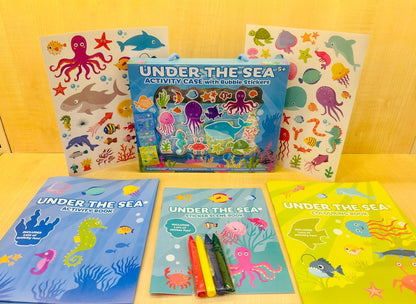Activity case opened showing sticker sheets, colouring books and crayons