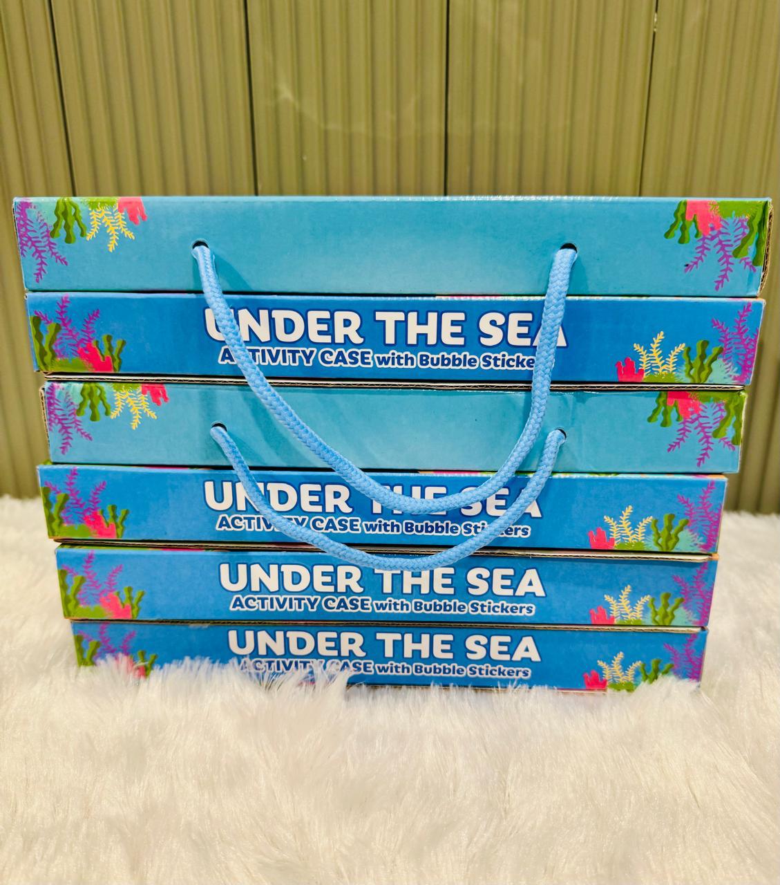 Six Under the Sea activity cases stacked showing their printed spines