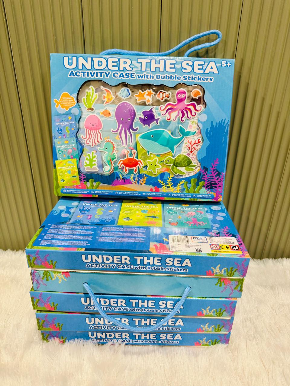 Under the Sea activity case stacked on more boxes with rope handle