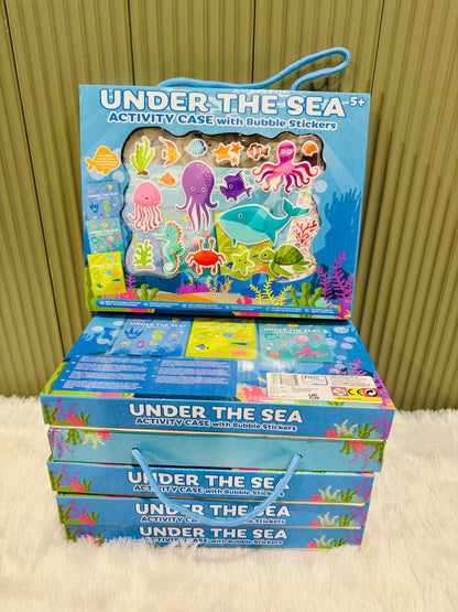 Under the Sea activity case stacked on more boxes with rope handle