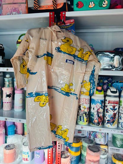 Cream duck print raincoat hanging in front of shop shelving