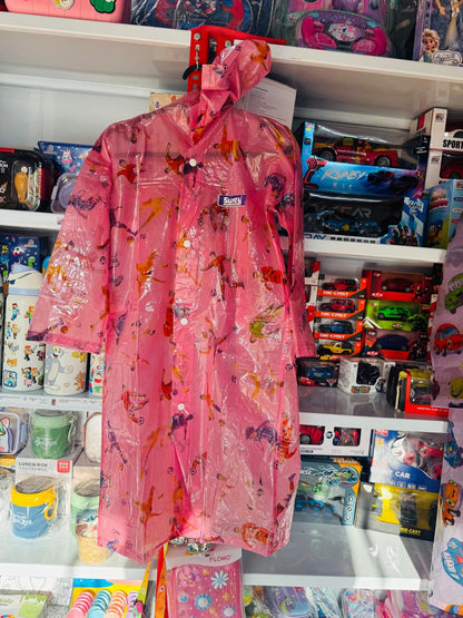 Pink cartoon print kids raincoat with hood hanging in a shop
