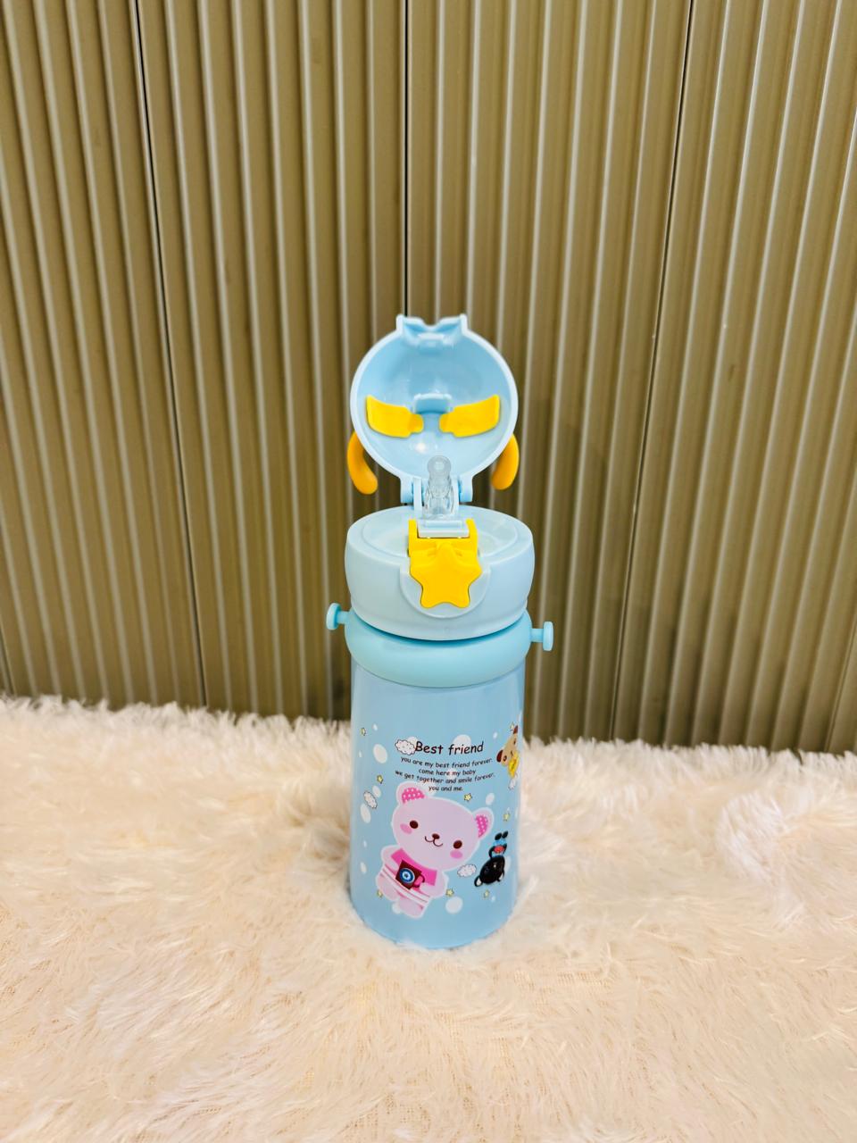 Blue reindeer bottle with flip lid open showing drinking straw