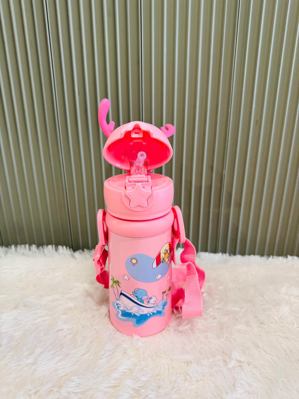 Pink reindeer bottle with flip lid open showing drinking straw