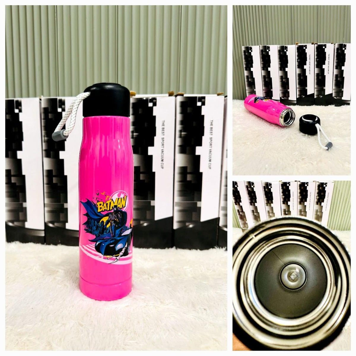 Pink 550ml bottle with caped superhero print in front of packaging