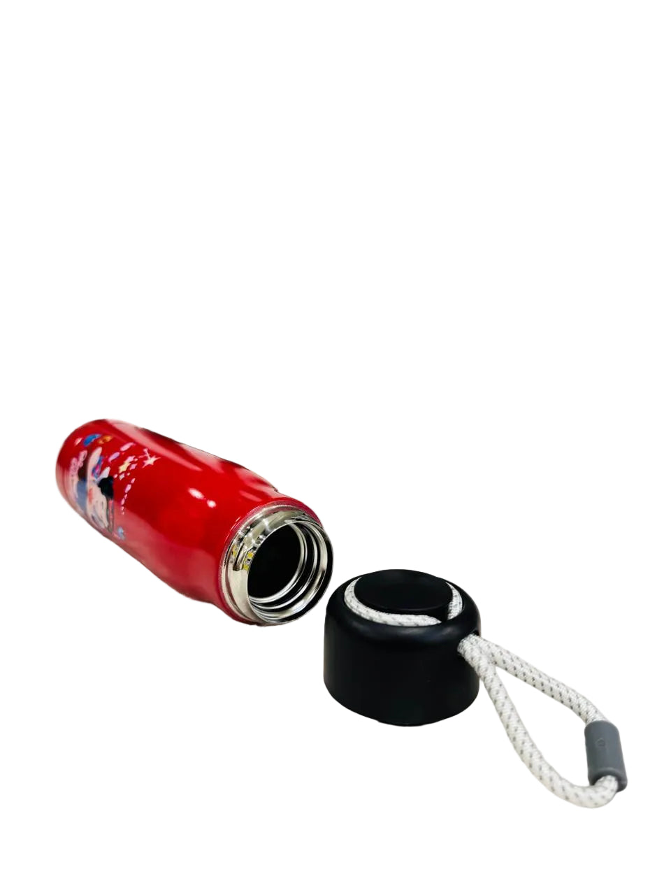 Red 550ml cartoon print bottle lying down beside its black lid