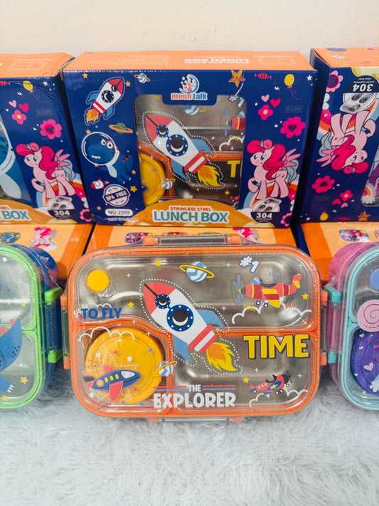 Orange rocket print lunch box in front of its printed packaging boxes