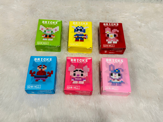 Assorted bricks block figure boxes grouped on a white fluffy surface
