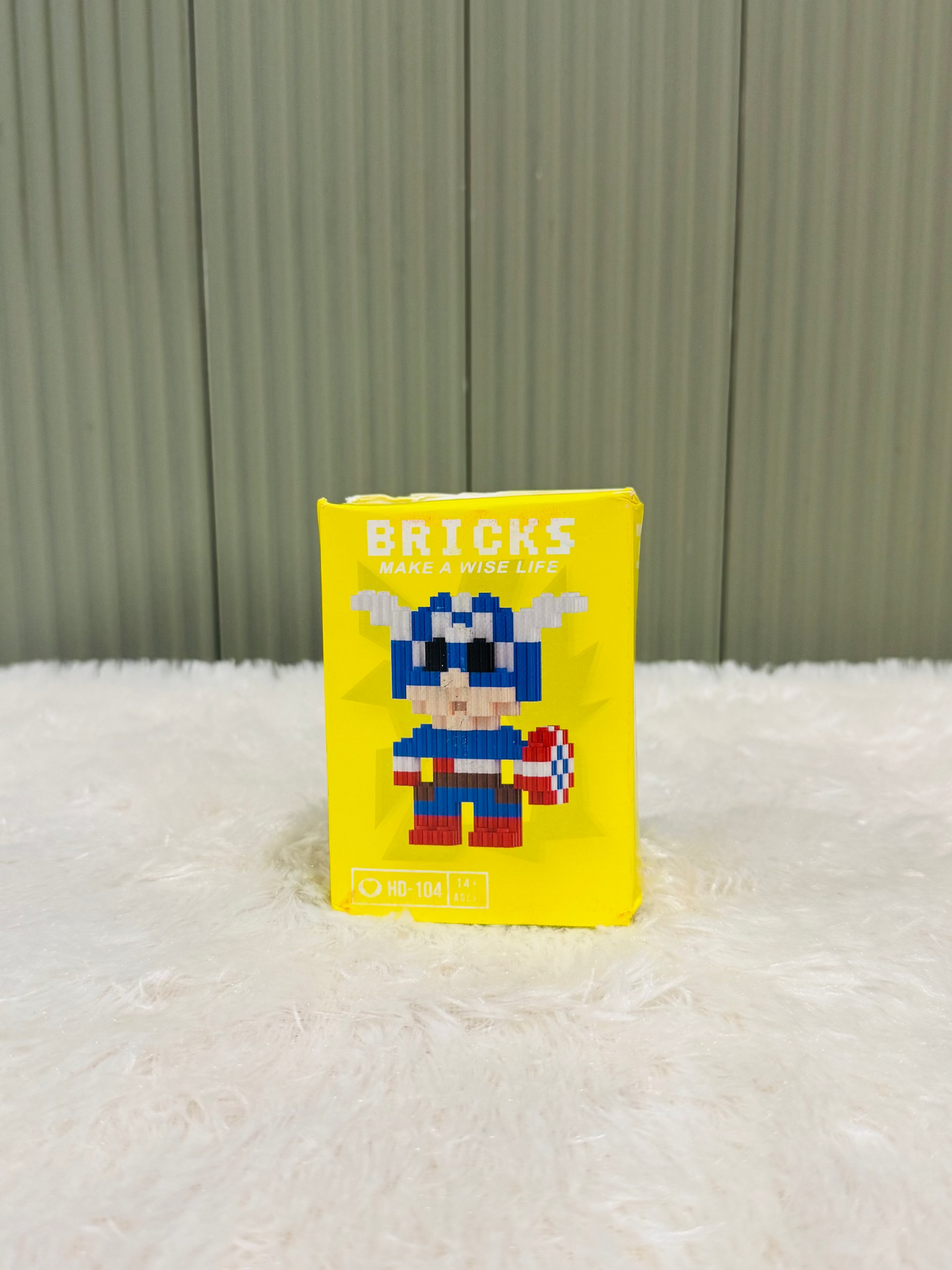Yellow bricks block box showing a superhero style mini figure design