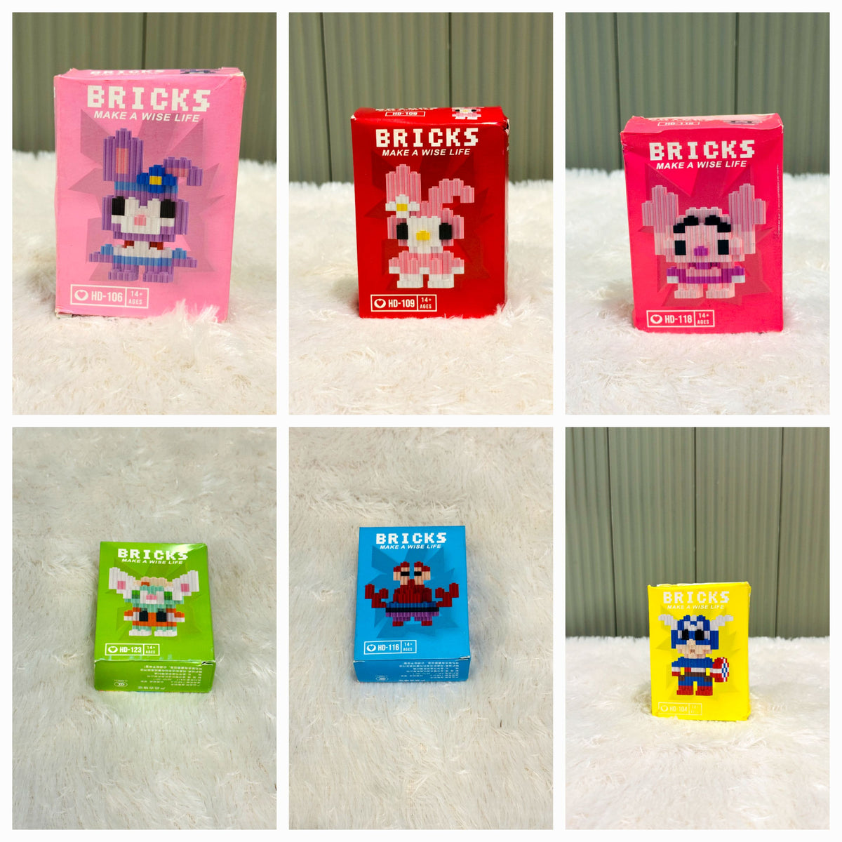 Grid of individual bricks block toy boxes in pink, red, green and blue