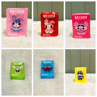 Grid of individual bricks block toy boxes in pink, red, green and blue