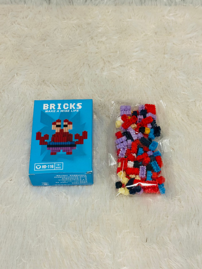 Blue bricks block box beside a bag of loose multicoloured building pieces
